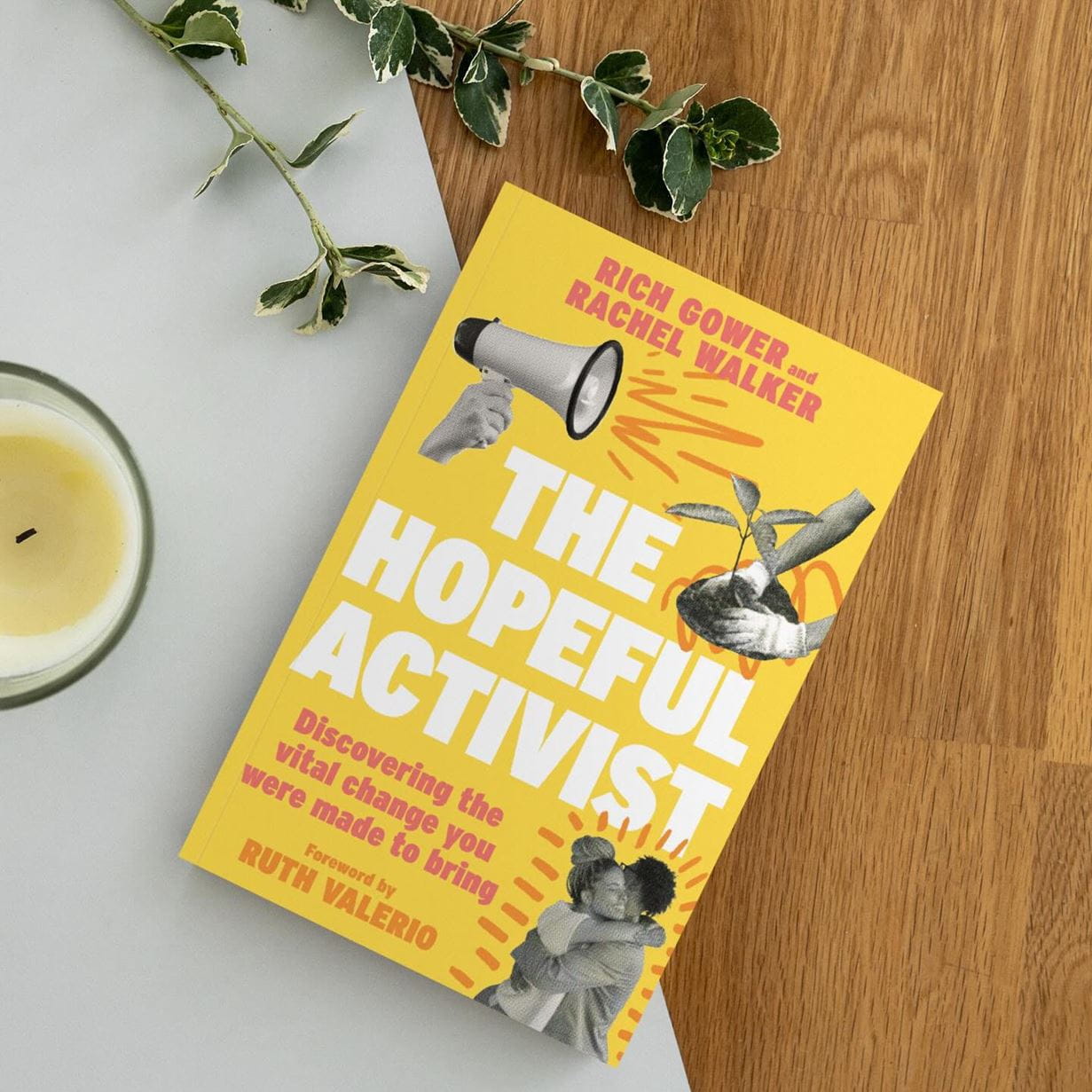 A yellow book with the title, 'The Hopeful Activist: Discovering the vital change you were made to bring', displaying a megaphone, two people in an embrace and a plant.